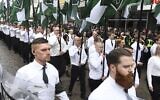 ILLUSTRATIVE -- Members of the far-right Nordic Resistance Movement march through the town of Ludvika, central Sweden, on May 1, 2018. (Ulf Palm/AFP via Getty Images via JTA)