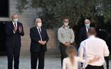From left, Defense Minister Benny Gantz, President Reuven Rivlin, IDF chief Aviv Kohavi and former national security adviser Yaakov Amidror give the Israel Security Prize to a recipient at the President's Residence in Jerusalem on September 13, 2020. (Kobi Gideon/GPO)