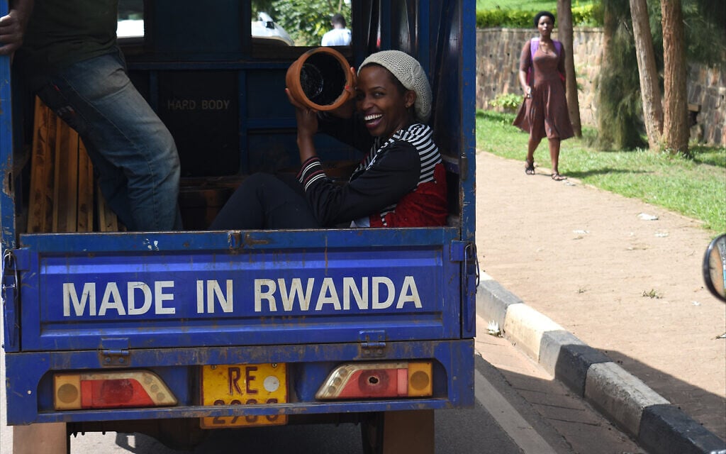 Truck bearing proud 'Made in Rwanda' banner in Kigali traffic, February 2020. (Larry Luxner/Times of Israel)