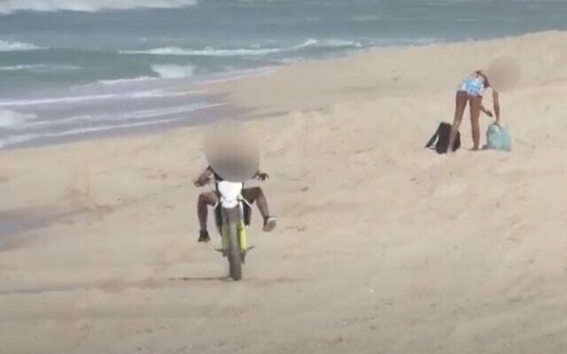 A man suspected of endangering beachgoers is seen driving on a motorcycle in the southern city of Ashdod on September 11, 2020. (Screen capture: YouTube) A man suspected of endangering beachgoers is seen driving on a motorcycle in the southern city of Ashdod on September 11, 2020. (Screen capture: YouTube)