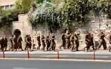 Soldiers from the IDF's religious Netzah Yehuda Battalion chant right-wing slogans at protesters outside the Prime Minister's Residence in Jerusalem on September 15, 2020. (Screen capture: Kikar Hashabbat)
