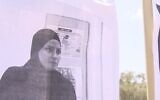 Screen capture from video of a picture of Sharifa Abu Muammar displayed on the gates of the school where she taught, September 1, 2020. (Channel 12)