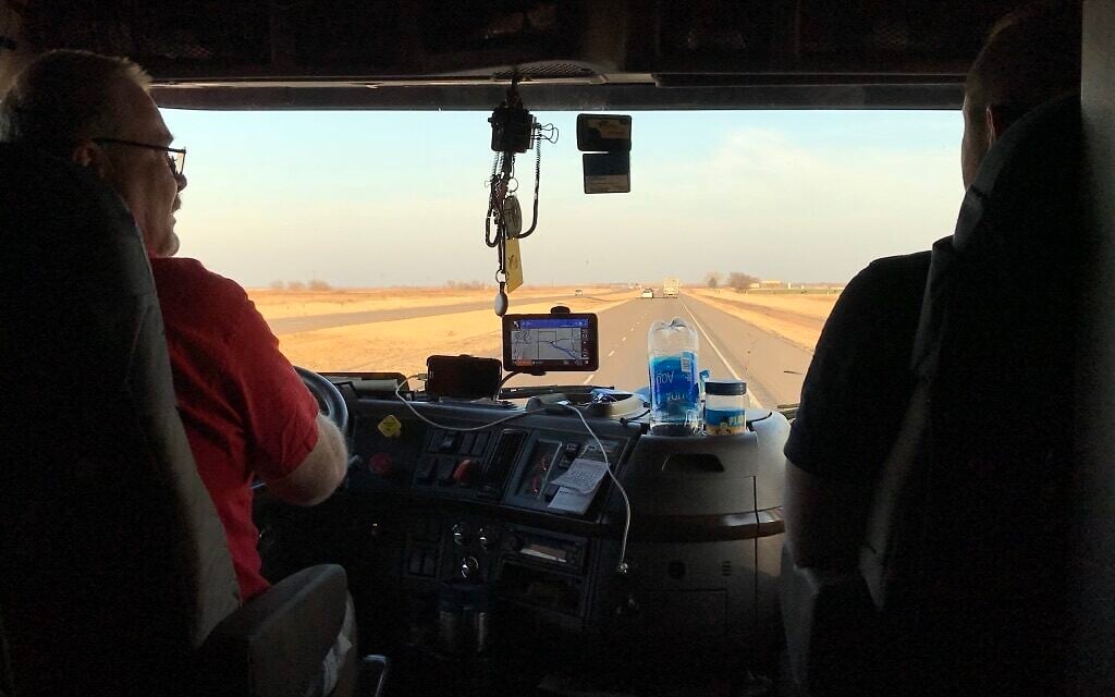 Jordan Blashek rides shotgun and speaks with Pete, a trucker who offered the duo a ride. (Courtesy)