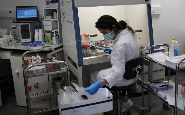 A lab technician prepares chemicals to process COVID-19 tests in Argenteuil, near Paris, Sept. 25, 2020. (AP Photo/Francois Mori) A lab technician prepares chemicals to process COVID-19 tests in Argenteuil, near Paris, Sept. 25, 2020. (AP Photo/Francois Mori)