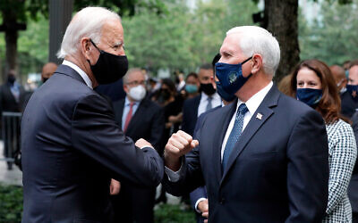 Democratic presidential candidate Joe Biden greets US Vice President Mike Pence at the 19th anniversary ceremony in observance of the September 11 terrorist attacks at the National September 11 Memorial & Museum in New York, September 11, 2020. (Amr Alfiky/The New York Times via AP, Pool)