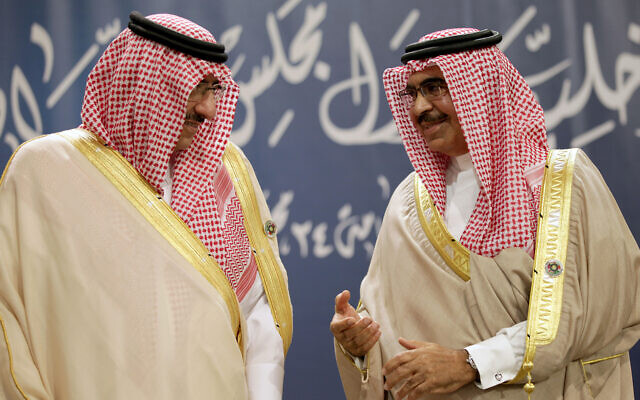 Saudi Interior Minister Prince Mohamed bin Nayef Al Saud, left, and Bahraini Interior Minister Sheik Rashid bin Abdullah Al Khalifa, right, speak together during a Gulf Cooperation Council interior ministers gathering to discuss security issues in Manama, Bahrain, November 28, 2013. (AP Photo/Hasan Jamali)