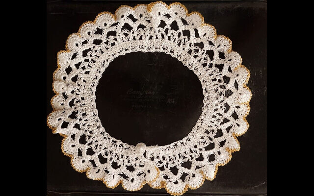 One of the late Supreme Court Justice Ruth Bader Ginsburg’s signature white lace jabot collars will go on display at the Museum of the Jewish People in Tel Aviv. (Courtesy/Museum of the Jewish People via JTA) One of the late Supreme Court Justice Ruth Bader Ginsburg’s signature white lace jabot collars will go on display at the Museum of the Jewish People in Tel Aviv. (Courtesy/Museum of the Jewish People via JTA)