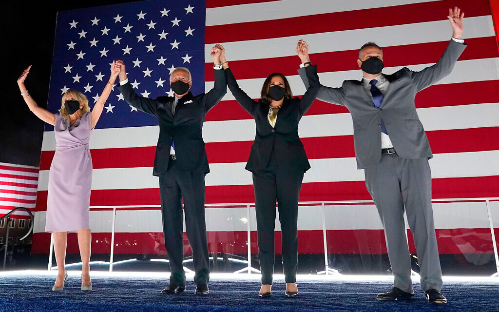 Democratic presidential candidate, 2nd from left, Joe Biden, and his wife Jill Biden, left, join Democratic vice presidential candidate Kamala Harris, 2nd from right, and her husband Doug Emhoff, during the fourth day of the Democratic National Convention, in Wilmington, Delaware, Aug. 20, 2020. (AP Photo/Andrew Harnik) Democratic presidential candidate, 2nd from left, Joe Biden, and his wife Jill Biden, left, join Democratic vice presidential candidate Kamala Harris, 2nd from right, and her husband Doug Emhoff, during the fourth day of the Democratic National Convention, in Wilmington, Delaware, Aug. 20, 2020. (AP Photo/Andrew Harnik)