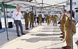 Defense Minister Benny Gantz, left, speaks to IDF soldiers during a visit to the IDF Central Command in Jerusalem, on September 15, 2020. (Ariel Hermoni/Defense Ministry)