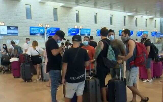 Israelis prepare to check in for their flights at Ben Gurion Airport, September 19, 2020 (Channel 12 screenshot) Israelis prepare to check in for their flights at Ben Gurion Airport, September 19, 2020 (Channel 12 screenshot)