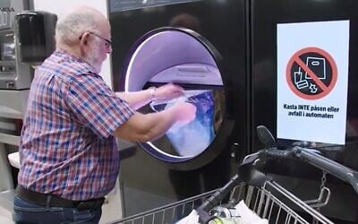 Putting used cans and bottles into an automated compression machine that delivers a voucher to return deposits paid in advance. (Screenshot Tomra Group)