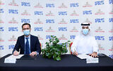 Ross Kriel, left, and Emirates Flight Catering CEO Saeed Mohammed signing an MOU about cooperating on kosher meals produced locally, Abu Dhabi, September 17, 2020 (courtesy Emirates)