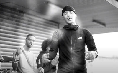 Issa Lorenzo Diakhaté, also known as Freeze Corleone, sings in a video clip for his 2020 album "The Phantom Threat." (Freeze Corleone/YouTube via JTA)