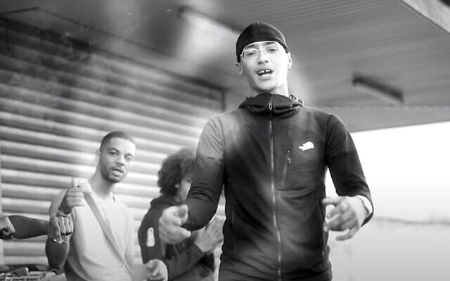 Issa Lorenzo Diakhaté, also known as Freeze Corleone, sings in a video clip for his 2020 album "The Phantom Threat." (Freeze Corleone/YouTube via JTA) Issa Lorenzo Diakhaté, also known as Freeze Corleone, sings in a video clip for his 2020 album "The Phantom Threat." (Freeze Corleone/YouTube via JTA)