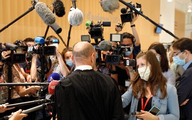 Charlie Hebdo's lawyer Richard Malka speaks to the press at the Tribunal de Paris courthouse in Paris, on September 9, 2020, during the trial of 14 people suspected of being accomplices in the Charlie Hebdo and Hyper Cacher jihadist killings. (GEOFFROY VAN DER HASSELT/AFP via JTA) Charlie Hebdo's lawyer Richard Malka speaks to the press at the Tribunal de Paris courthouse in Paris, on September 9, 2020, during the trial of 14 people suspected of being accomplices in the Charlie Hebdo and Hyper Cacher jihadist killings. (GEOFFROY VAN DER HASSELT/AFP via JTA)
