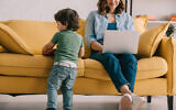 An illustrative image of a mother working from home (LightFieldStudios; iStock by Getty Images)