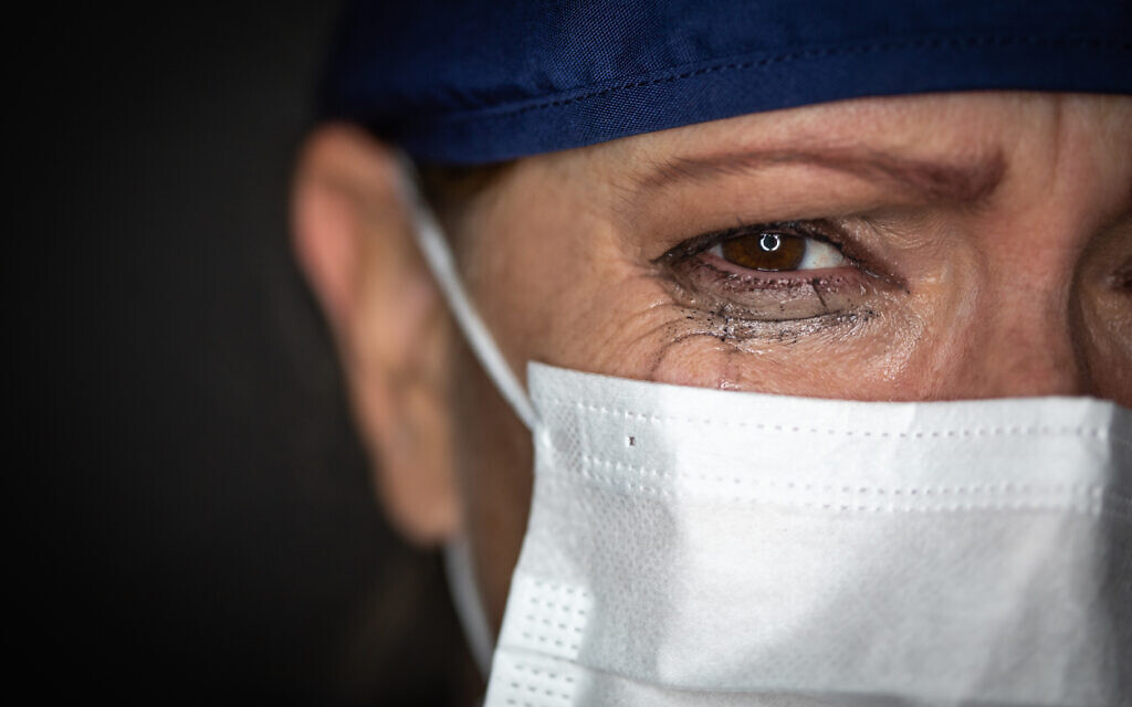 A medical professional sheds a tear over the human cost of the pandemic (iStock) A medical professional sheds a tear over the human cost of the pandemic (iStock)
