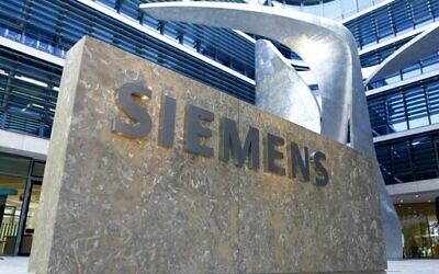The logo of German industrial conglomerate Siemens at its headquarters in Munich, Germany, June 24, 2016. (AP Photo/Matthias Schrader, file)