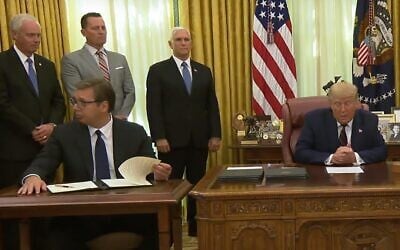 Serbian President Aleksandar Vucic (seated, left) appears to react with puzzlement as US President Donald Trump announces that his country will be moving its Israel embassy to Jerusalem by July 2021. (screenshot)