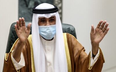 Sheikh Nawaf al-Ahmad Al-Sabah salutes the crowd after being sworn in as Kuwait's new emir, at the National Assembly in Kuwait City on September 30, 2020. (Yasser Al-Zayyat/AFP)