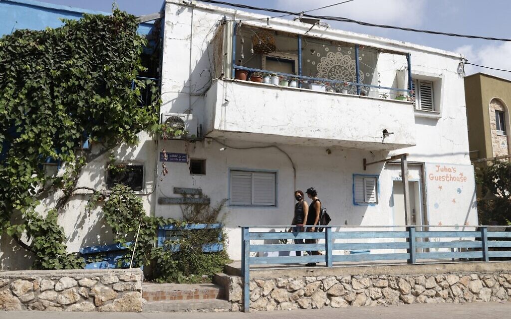 Israeli Naama Goldman-Shwartz, 45, walks with a guest at Juha's Guesthouse in the northern coastal village of Jisr az-Zarqa on September 30, 2020 (Jack Guez/AFP) Israeli Naama Goldman-Shwartz, 45, walks with a guest at Juha's Guesthouse in the northern coastal village of Jisr az-Zarqa on September 30, 2020 (Jack Guez/AFP)
