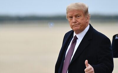 US President Donald Trump gives a thumbs up as he steps off Air Force One upon arriving at Andrews Air Force Base in Maryland on October 1, 2020. (Mandel Ngan/AFP)