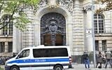 Illustrative: A police car stands outside a court in Berlin on October 7, 2020 (Tobias Schwarz / AFP)
