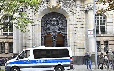 Illustrative: A police car stands outside a court in Berlin on October 7, 2020 (Tobias Schwarz / AFP)