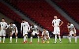 Israeli players watch the penalty shootout during the Euro 2020 playoff semi-final soccer match between Scotland and Israel at Hampden Park, Glasgow, on October 8, 2020. (Andy Buchanan/AFP)