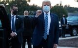 US President Donald Trump pumps his fist as he leaves Walter Reed Medical Center in Bethesda, Maryland, to return to the White House after being discharged, October 5, 2020. (Saul Loeb/AFP)