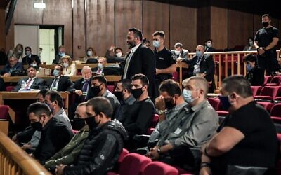 Independent European parliamentarian Yiannis Lagos (C), who defected from the Golden Dawn party in 2019, stands in a courtroom in Athens on October 12, 2020. (LOUISA GOULIAMAKI/AFP)