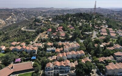 A picture taken on October 13, 2020, shows the Har Gilo settlement in the West Bank, with the city of Jerusalem seen in the background. (MENAHEM KAHANA / AFP)