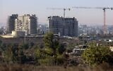New apartments buildings under construction in the Beit El settlement in the West Bank with the Palestinian city of Ramallah in the background, October 13, 2020. (Menahem Kahana/AFP)