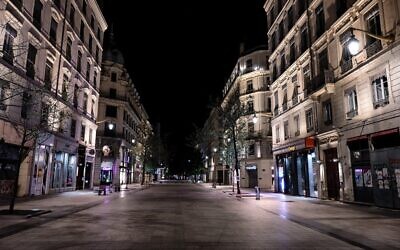 A deserted Republique street in Lyon, as a curfew is in place to fight the spread of COVID-19 (JEFF PACHOUD / AFP)