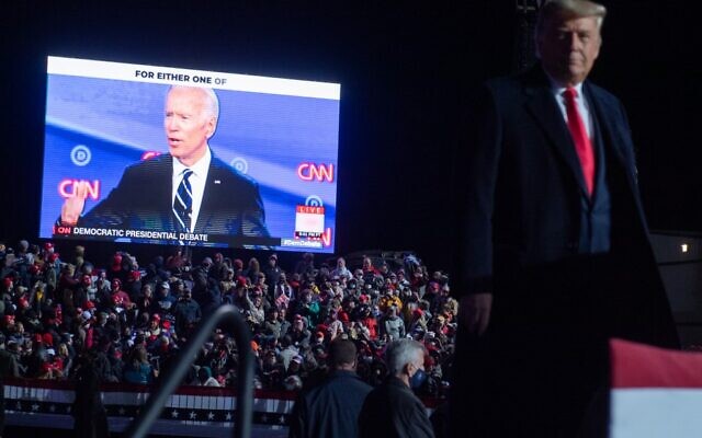 US President Donald Trump watches a video of Democratic presidential nominee former Vice President Joe Biden as he holds a Make America Great Again rally at a campaign rally at Erie International Airport in Erie, Pennsylvania, October 20, 2020. (Photo by SAUL LOEB / AFP) US President Donald Trump watches a video of Democratic presidential nominee former Vice President Joe Biden as he holds a Make America Great Again rally at a campaign rally at Erie International Airport in Erie, Pennsylvania, October 20, 2020. (Photo by SAUL LOEB / AFP)
