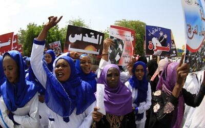 Illustrative: Sudanese protestors shouting slogans during a rally in the capital Khartoum to denounce Israel's military offensive on the Gaza Strip, August 11, 2014. (Ashraf SHAZLY / AFP / File)