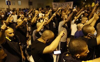Arab-Israeli protesters gather outside the residence of the French Ambassador to Israel, in Tel Aviv on October 24, 2020, in response to comments by French President Emmanuel Macron defending cartoons of the Prophet Mohammed. (JACK GUEZ / AFP)