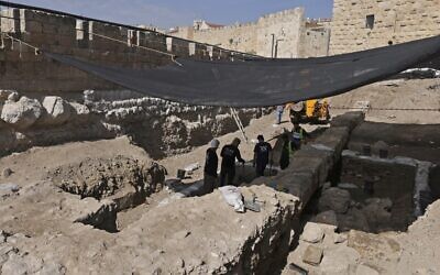 Workers dig at an archaeological site at the Tower of David Museum in the ancient citadel of Jerusalem near the Jaffa Gate entrance to Jerusalem's Old City on October 28, 2020. (MENAHEM KAHANA / AFP)
