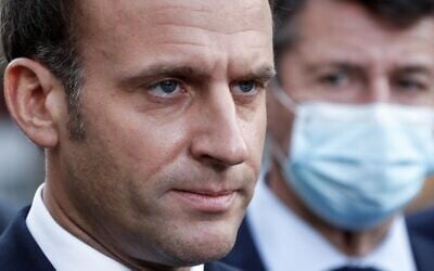 French President Emmanuel Macron (L) speaks to the press as Nice's mayor Christian Estrosi (R) listens outside the the Notre-Dame de l'Assomption Basilica in Nice on October 29, 2020 after a jihadist attack in the city. (Eric Gaillard/POOL/AFP)