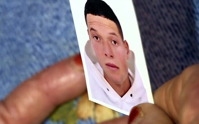 This image grab from AFP TV shows a picture of Nice assailant Brahim Issaoui, who a day earlier killed three people and wounded several others in the southern French city of Nice, held by his mother at the family home in the Tunisian city of Sfax, on October 30, 2020. (AFPTV teams / AFP) This image grab from AFP TV shows a picture of Nice assailant Brahim Issaoui, who a day earlier killed three people and wounded several others in the southern French city of Nice, held by his mother at the family home in the Tunisian city of Sfax, on October 30, 2020. (AFPTV teams / AFP)