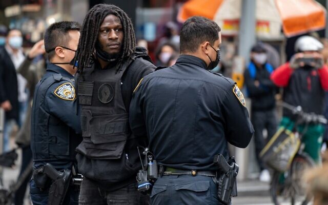 A person is arrested during a march and rally for President Donald Trump on 5th Avenue on October 25, 2020 in New York City. (David Dee Delgado/Getty Images/AFP) A person is arrested during a march and rally for President Donald Trump on 5th Avenue on October 25, 2020 in New York City. (David Dee Delgado/Getty Images/AFP)