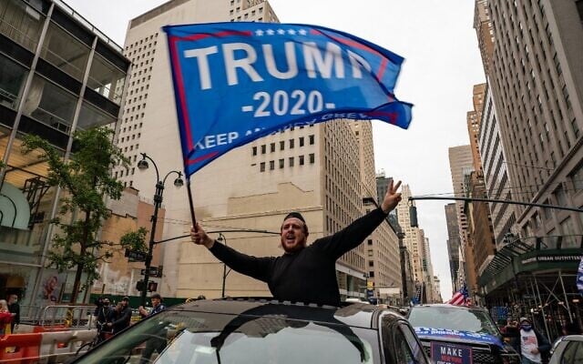 A person participates in a march and rally for US President Donald Trump on 5th Avenue on October 25, 2020, in New York City. (David Dee Delgado/Getty Images/AFP) A person participates in a march and rally for US President Donald Trump on 5th Avenue on October 25, 2020, in New York City. (David Dee Delgado/Getty Images/AFP)