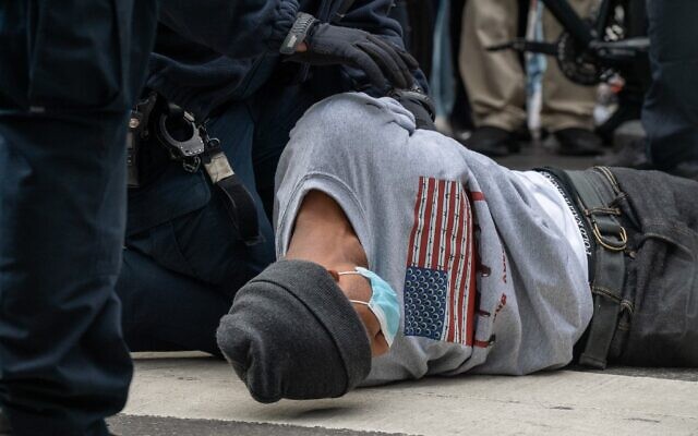 A person is arrested during a march and rally for President Donald Trump at Times Square on October 25, 2020 in New York City. (David Dee Delgado/Getty Images/AFP) A person is arrested during a march and rally for President Donald Trump at Times Square on October 25, 2020 in New York City. (David Dee Delgado/Getty Images/AFP)