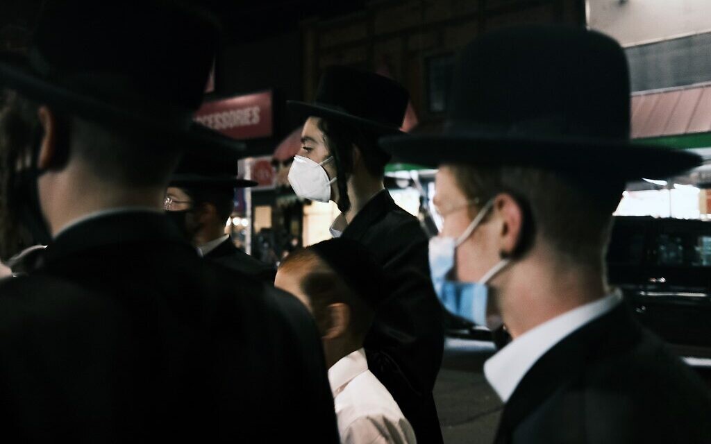 Illustrative: Young members of the Hasidic community gather in the Brooklyn neighborhood of Borough Park to denounce lockdowns of their neighborhood due to a spike in COVID-19 cases on October 7, 2020, in New York City. (Spencer Platt/Getty Images/AFP) Illustrative: Young members of the Hasidic community gather in the Brooklyn neighborhood of Borough Park to denounce lockdowns of their neighborhood due to a spike in COVID-19 cases on October 7, 2020, in New York City. (Spencer Platt/Getty Images/AFP)