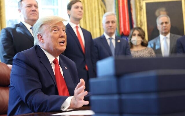 President Donald Trump speaks about a Sudan-Israel peace agreement, in the Oval Office on October 23, 2020 in Washington, DC. Jared Kushner is behind him (Win McNamee/Getty Images/AFP President Donald Trump speaks about a Sudan-Israel peace agreement, in the Oval Office on October 23, 2020 in Washington, DC. Jared Kushner is behind him (Win McNamee/Getty Images/AFP