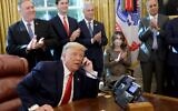 US President Donald Trump speaks with Prime Minister Benjamin Netanyahu on the phone about a Sudan-Israel peace agreement, in the Oval Office on October 23, 2020 in Washington. (Win McNamee/Getty Images/AFP)