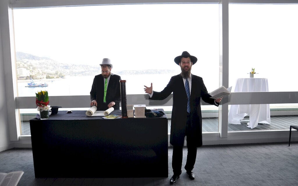 Rabbi Tanhoum Matusof reads from the Book of Esther on Purim in Monaco, February 28, 2018. (Courtesy of the Jewish Cultural Center of Monaco/ via JTA)