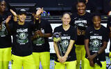 Sue Bird #10 of the Seattle Storm holds on to the WNBA Championship Trophy after defeating the Las Vegas Aces 92-59 in Game 3 of the WNBA Finals at Feld Entertainment Center on October 06, 2020, in Palmetto, Florida. (Julio Aguilar/Getty Images)