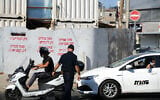 Illustrative: A police officer in Bnei Brak on October 18, 2020.  (Tomer Neuberg/Flash90)
