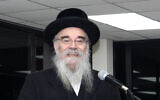 In this December 20, 2017, photo provided by Joel Friedman, Rabbi Avrohom Pinter makes a speech at Canvey Island,in Essex, southeast England. (Joel Friedman via AP)
